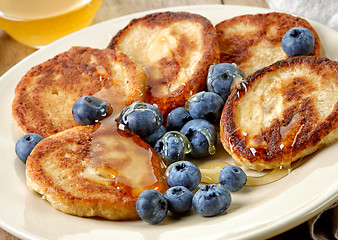 Image showing Pancakes with honey and blueberries