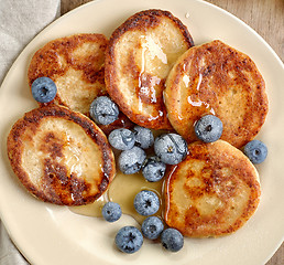 Image showing Pancakes with honey and blueberries