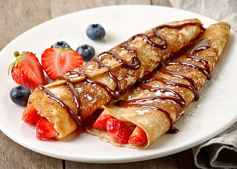 Image showing Crepes with strawberries and chocolate