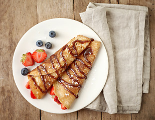 Image showing Crepes with strawberries and chocolate