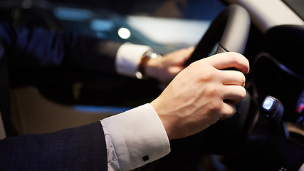 Image showing hands on a steering wheel