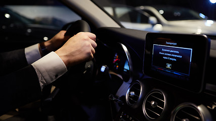 Image showing hands on a steering wheel