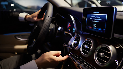 Image showing hands on a steering wheel