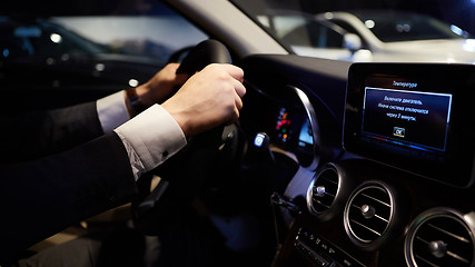 Image showing hands on a steering wheel