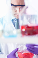 Image showing Chemist searching for the right solution.