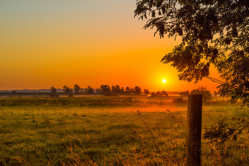 Image showing Misty morning with a sunrise