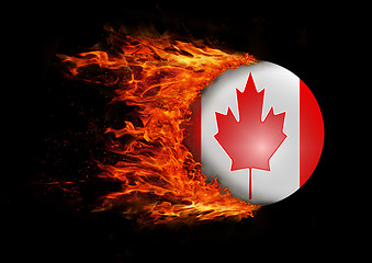 Image showing Flag with a trail of fire - Canada