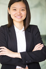 Image showing Young Asian female business executive smiling portrait