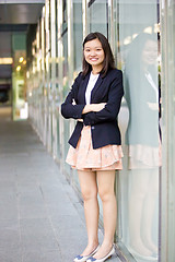 Image showing Young Asian female business executive smiling portrait