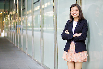 Image showing Young Asian female business executive smiling portrait