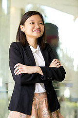 Image showing Young Asian female business executive smiling portrait