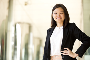 Image showing Young Asian female business executive smiling portrait