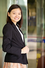 Image showing Young Asian female business executive smiling portrait