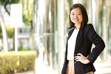 Image showing Young Asian female business executive smiling portrait