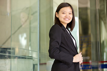 Image showing Young Asian female business executive smiling portrait