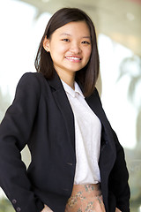 Image showing Young Asian female business executive smiling portrait