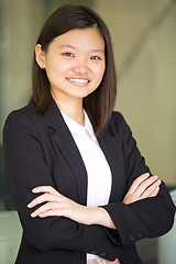 Image showing Young Asian female business executive smiling portrait