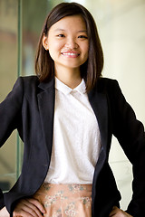 Image showing Young Asian female business executive smiling portrait