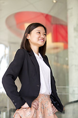 Image showing Young Asian female business executive smiling portrait