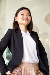 Image showing Young Asian female business executive smiling portrait