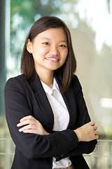 Image showing Young Asian female business executive smiling portrait