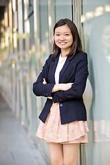 Image showing Young Asian female business executive smiling portrait