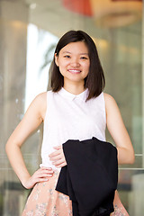 Image showing Young Asian female business executive smiling portrait