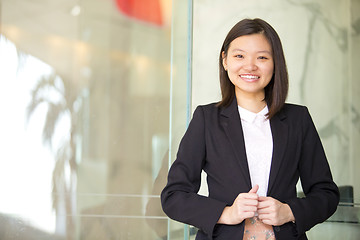 Image showing Young Asian female business executive smiling portrait