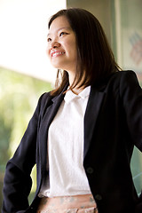 Image showing Young Asian female business executive smiling portrait