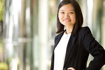 Image showing Young Asian female business executive smiling portrait