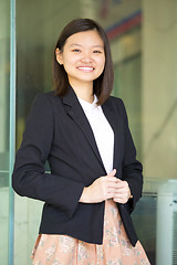 Image showing Young Asian female business executive smiling portrait