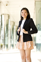 Image showing Young Asian female business executive smiling portrait