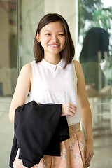 Image showing Young Asian female business executive smiling portrait