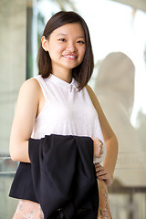 Image showing Young Asian female business executive smiling portrait