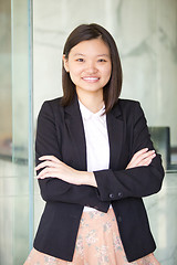 Image showing Young Asian female business executive smiling portrait