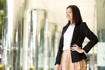 Image showing Young Asian female business executive smiling portrait