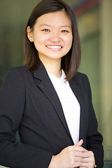 Image showing Young Asian female business executive smiling portrait