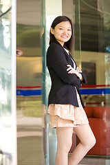 Image showing Young Asian female business executive smiling portrait