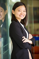 Image showing Young Asian female business executive smiling portrait