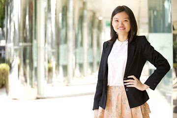 Image showing Young Asian female business executive smiling portrait