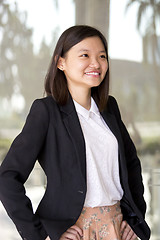 Image showing Young Asian female business executive smiling portrait