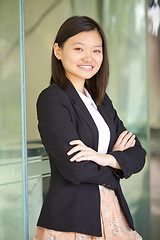 Image showing Young Asian female business executive smiling portrait