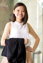 Image showing Young Asian female business executive smiling portrait