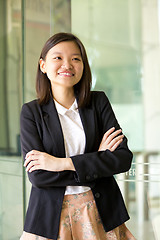 Image showing Young Asian female business executive smiling portrait