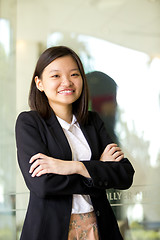 Image showing Young Asian female business executive smiling portrait