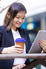 Image showing Young Asian female business executive using tablet