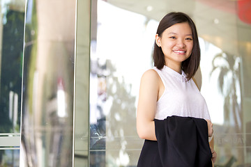 Image showing Young Asian female business executive smiling portrait