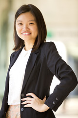 Image showing Young Asian female business executive smiling portrait