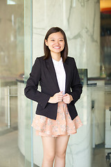 Image showing Young Asian female business executive smiling portrait