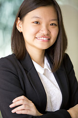 Image showing Young Asian female business executive smiling portrait